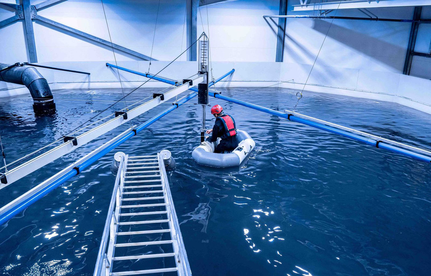 An AKVA Group employee working on a land-based aquaculture facility