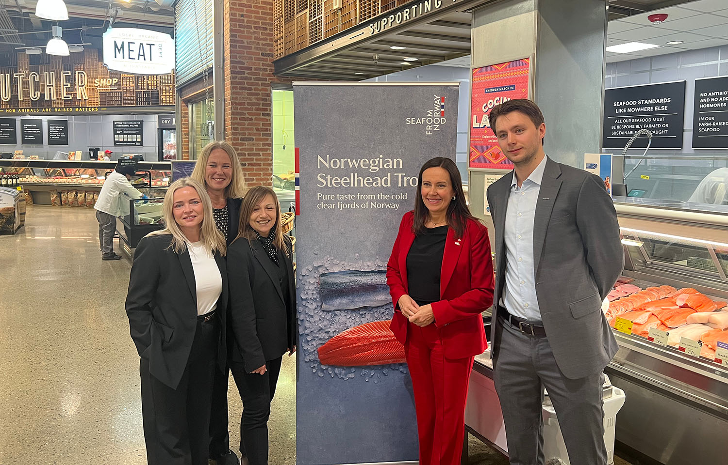A delegation including Norwegian Fisheries Minister Marianne Sivertsen Næss (center right) toured a Whole Foods retail store in Boston, Massachusetts, U.S.A. on 15 March