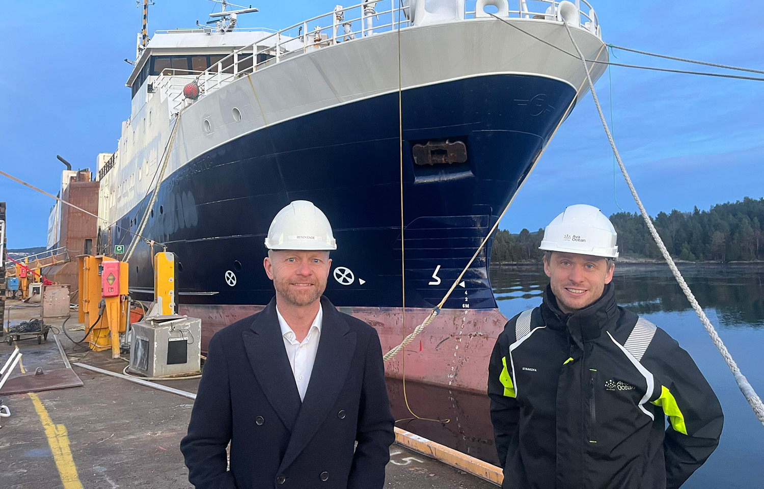 Ava Ocean Group CEO Øystein Tvedt and Board Chair Stian Tennfjord in front of the new vessel, Ava Pearl, which will recommence the company's non-invasive scallop fishing in the Barents Sea within the next few months