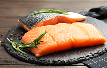 Salmon on a plate with greens