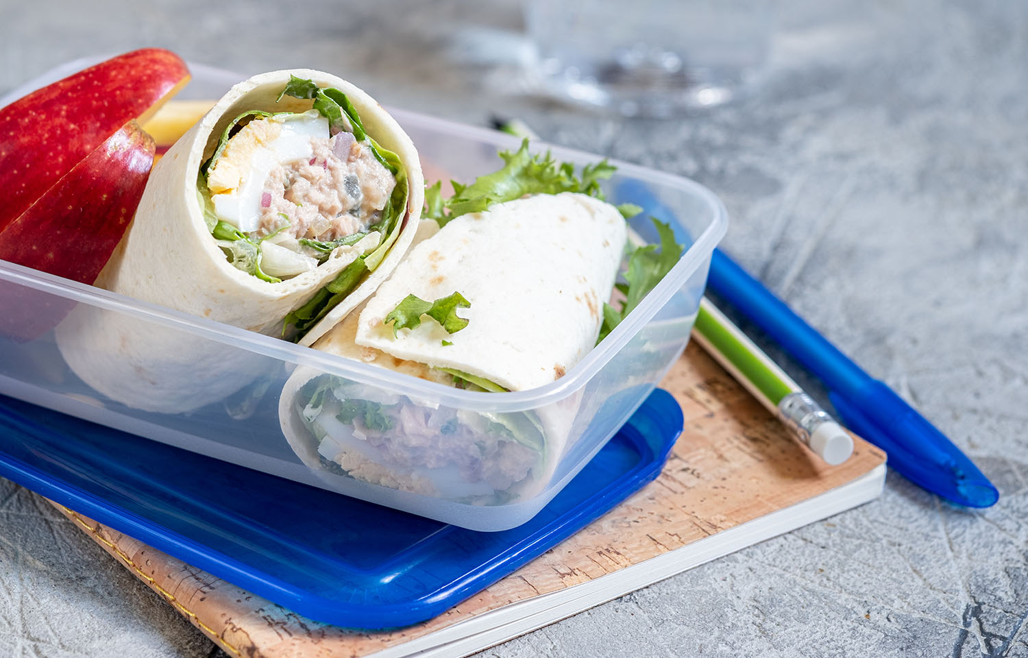 A school lunch featuring a tuna wrap