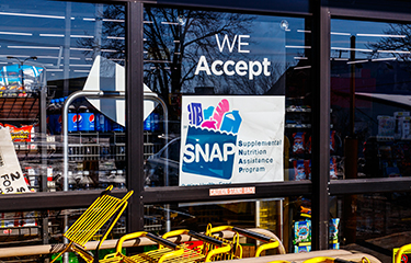 A supermarket with a SNAP sign.