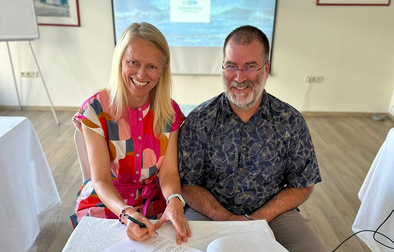 MarinTrust Executive Chair Libby Woodhatch and SFP Deputy Division Director Dave Martin signing the MoU