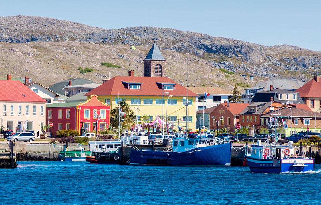 A fishing boat sailing into the harbor or St. Pierre and Miquelon