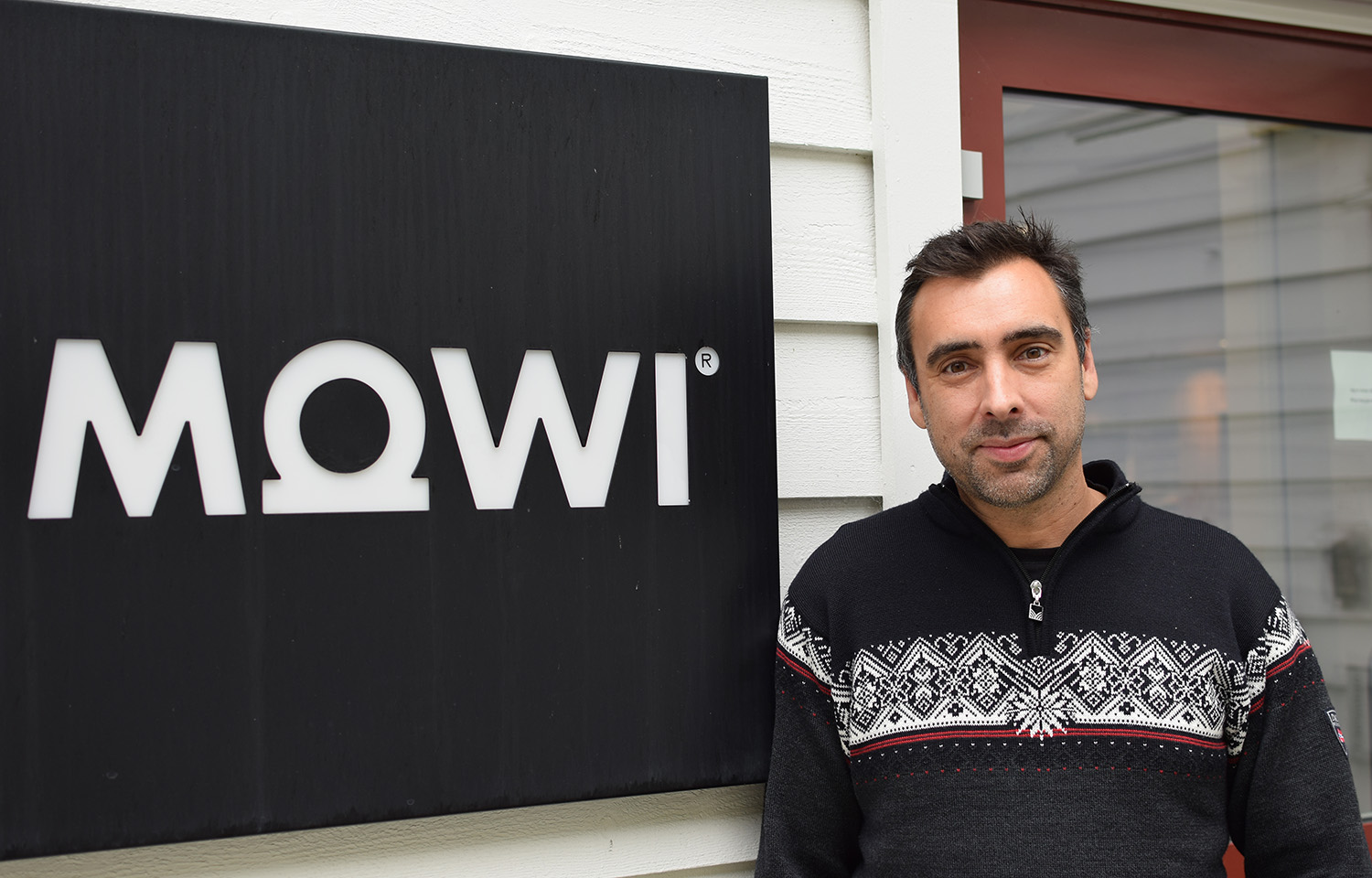 Matt Baranski of Mowi Genetics next to a Mowi sign