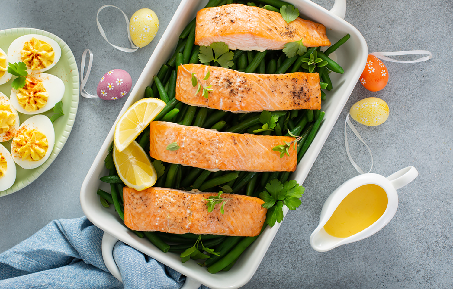 A salmon dish with Easter eggs surrounding it