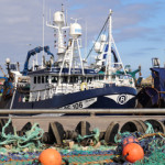 Scottish fishing vessels tied up at the dock.