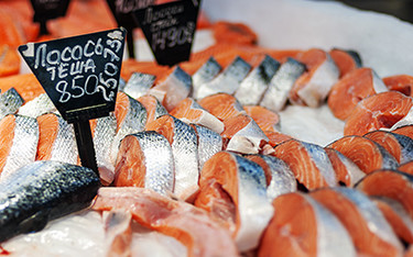 Dozens of pieces of salmon displayed at a Russian market.