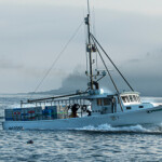 A Maine lobster fishing boat heads out to sea.
