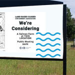 A sign indicating the proposed site of a potential land-based salmon farm in Yarmouth, Nova Scotia, Canada