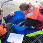 An RSPCA Assured inspection team on-site at a U.K. salmon farm.