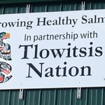 A sign promoting the partnership between Grieg Seafood and the Tlowitsis Nation