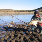 A fisher in South Africa poses with their catch. The country's new inland fisheries policy hopes to enhance food security and drive economic development.