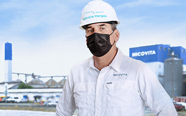 A Vitapro employee stands in front of a new Nicovita facility.