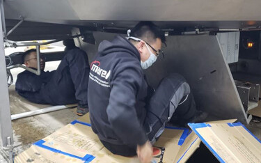 Marel technicians installing processing machinery