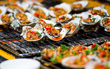 Oysters situated on a grill in Xiamen, China.