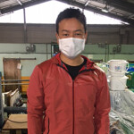 A Rikusui employee standing in the company's main building.