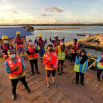 The staff of a Barramundi Group facility pose for a photo.