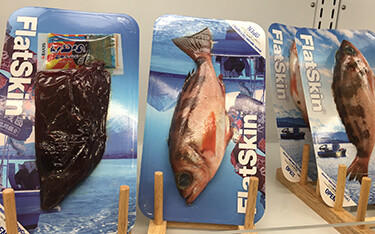 A set of seafood products packaged in SealPac's FlatSkin system.