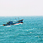 A fishing vessel navigates the South China Sea.