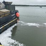 A ship discharging waste outside of Silver Bay Seafoods' facility