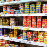 Canned fish on the shelves of a Russian market.