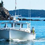 A lobster boat in Maine returns to the harbor