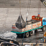 A crane loads tuna onto a truck in Ecuador.