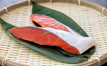 Slices of salmon being offered as part of Seven & I Group's Alaska Seafood Fair.