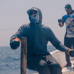 A pair of handline fishermen in Oman work to catch tuna.