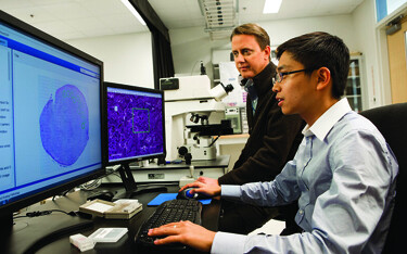 Officials with the FDA examine the results of testing on a computer.