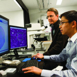 Officials with the FDA examine the results of testing on a computer.