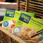 Two packages of OMG Meat's new plant-based shrimp dumplings.