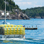 A lobster boat loaded with traps in Bar Harbor, Maine.
