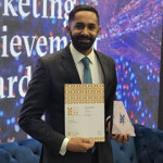 Sea Harvest Group Limited Head of Marketing Jared Patel receiving the Mondelēz 2022 Rising Star of the Year Award.