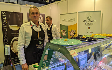Nicolas Brossard poses in the Marennes Oleron booth at Seafood Expo Asia.