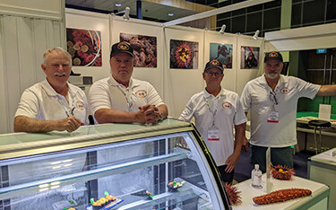 The staff of the Pacific Urchin Harvesters Association at their booth at Seafood Expo Asia.