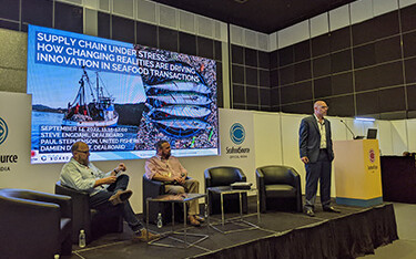 Paul Stephenson, Damien De Ment, and Steve Engdahl on stage during a panel at Seafood Expo Asia.