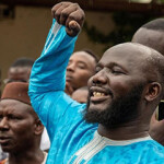 Members of the Taxawu Cayar Collective protest in front of Senegal's High Court.