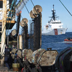 U.S. Coast Guard members conduct a boarding of a fishing vessel in the Eastern Pacific, 4 August, 2022.