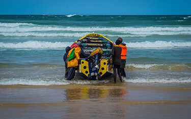A fishing boat preparing to launch in Senegal.