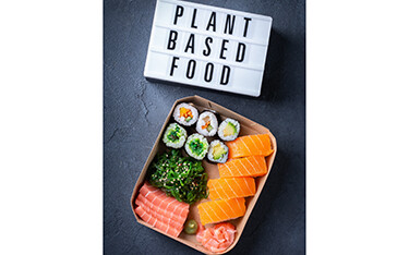 A Plant based food sign featuring plant based seafood analogs.