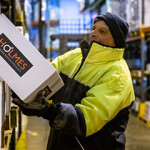 A Holmes Seafood employee at work.