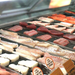 A seafood counter in the U.S. featuring fillets of several different species of fish.