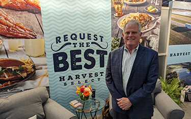 Harvest Select CEO Randy Rhodes inside the company's booth at Seafood Expo North America.