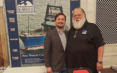Sea Watch International Senior Vice President of Sales and Marketing Guy Simmons (right).
