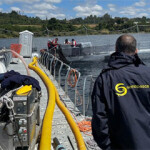 Officials with Sernapesca monitoring a salmon escape in Llanquihue Lake, in the Los Lagos region.