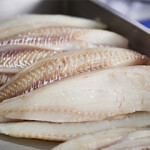 A pile of fillets of whitefish.