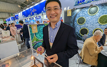Sichuan Runzhao Sturgeon Import and Export General Manager Fu Wenyang showing off some of the company's product.