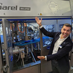 Marel Global Sales Director Diego Lages showing off the company's new MS 2750 salmon filleting machine.